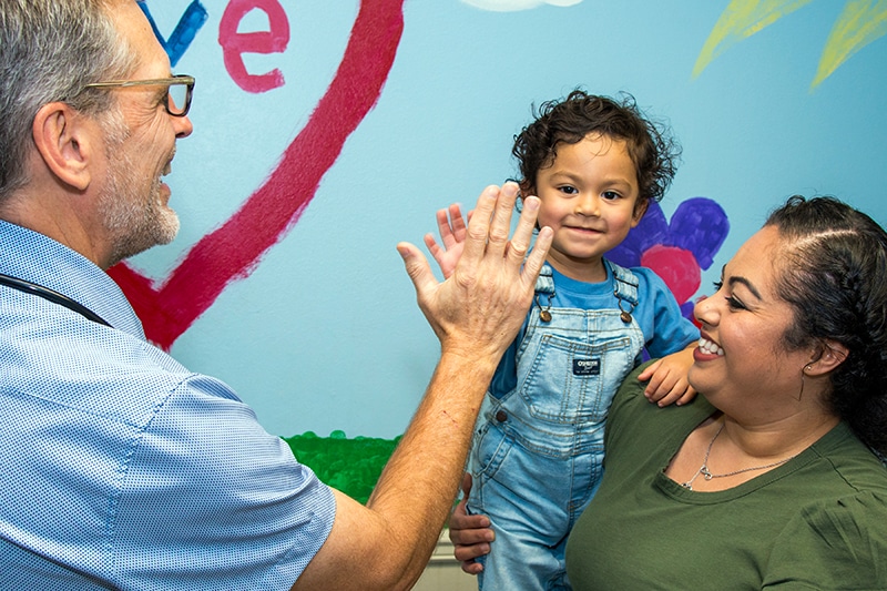 Bethesda Pediatrics - A doctor checking a baby girl heartbeat